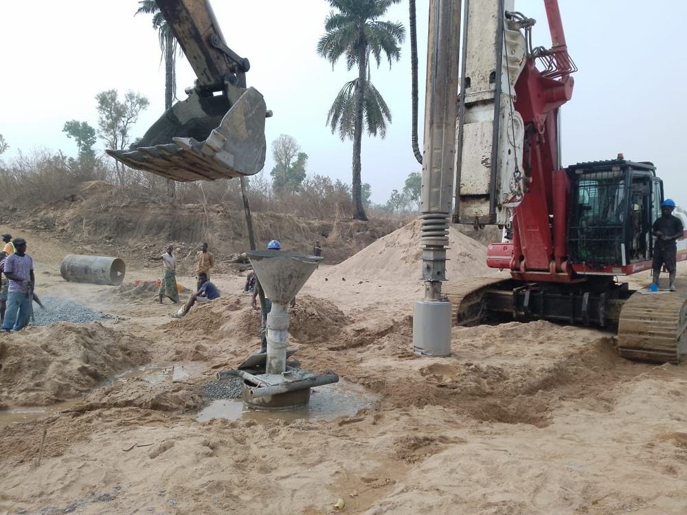 Bored pile being concreted with a tremie funnel
