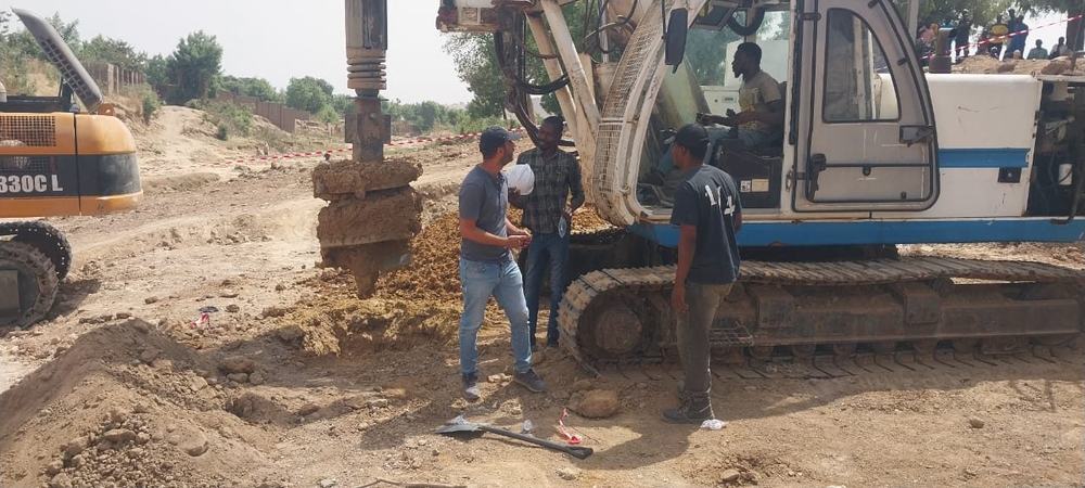 Rotary piling rig with auger on a Cigeotech foundation site